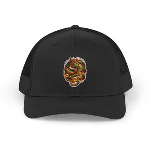 May include: Black trucker cap with a mesh back and a curved peak. The front displays a colourful embroidered dragon design in green, orange, and yellow.