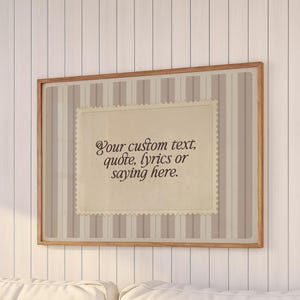 May include: A white ceramic mug with a black handle and the text "But First, Coffee" in a bold, black font. The mug is set against a blurred background, suggesting a cosy setting.
