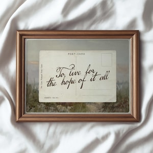 Vintage postcard wall art featuring the handwritten quote “To live for the hope of it all” in a nostalgic romantic aesthetic with soft neutral tones.
