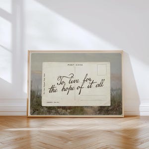 Vintage postcard wall art featuring the handwritten quote “To live for the hope of it all” in a nostalgic romantic aesthetic with soft neutral tones.