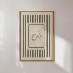This vintage duck art print features two hand-drawn ducks among flowers, framed by soft sage stripes and a scalloped border. Ideal for cottagecore nurseries, farmhouse spaces, or elegant gallery walls, it adds gentle charm and a nature-inspired warmth to any room.
