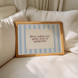 Framed custom quote printable with vintage cream parchment and pale blue vertical stripes. Editable wall art for personalized messages, lyrics, or names – perfect for baby gifts, coastal decor, or soft romantic spaces.