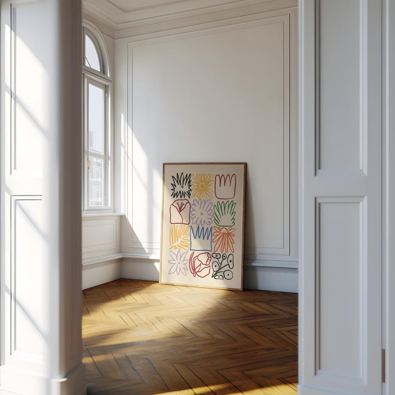 May include: A framed art print featuring a colorful abstract floral design. The artwork showcases nine distinct squares, each filled with unique, hand-drawn flower and plant illustrations in vibrant colors like red, yellow, and green, set against a cream background.