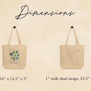 May include: Two beige canvas tote bags. One bag features a watercolor illustration with the word "Yahaha!" below. The other bag is plain. The bags have 1-inch wide dual straps, 24.5 inches long. The illustrated bag is 16" x 14.5" x 5".