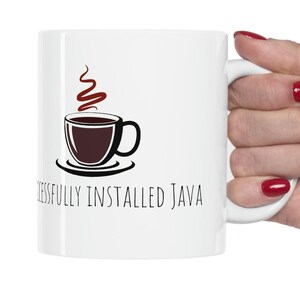 May include: White ceramic mug with a black and brown illustration of a coffee cup with steam rising from it. The text "Successfully Installed Java" is printed below the illustration.