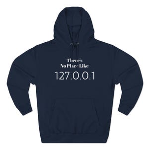 May include: A navy blue hooded sweatshirt with the text "There's No Place Like 127.0.0.1" printed in white on the front.
