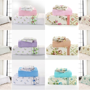 May include: Collection of bed linen sets in diverse colours and floral designs. Each set includes a fitted sheet, flat sheet, and pillowcases. The sets feature colours like pink, lavender, blue, and beige, with floral designs in white, green, and pink.