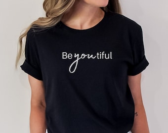 May include: Black t-shirt with white text that reads "Be youtiful".
