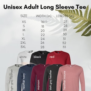 May include: Unisex long-sleeve tee shirt size chart with measurements in inches. The chart shows sizes XS to 3XL with corresponding width and length measurements. The image also shows a variety of colours including white, black, red, maroon, heather navy, light grey heather, dark grey heather, and heather mauve.