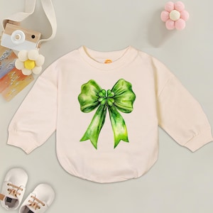 St. Patrick’s Day Coquette Romper Sweatshirt, St. Patrick’s Day Bow, Four leaf clover Baby Outfit, Irish Holiday, Newborn Gift, Baby Shower