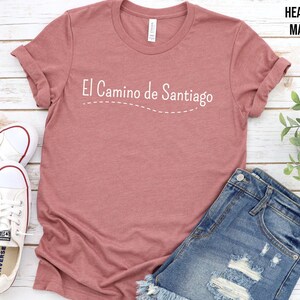 a t - shirt that says i canno de santiago next to a pair of