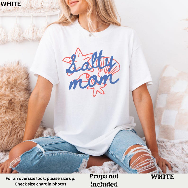 May include: White t-shirt with a blue and red graphic that says "Salty Mom" with a starfish and seashells.