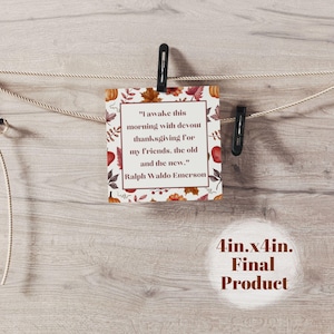 May include: A square card, 4 inches by 4 inches, with a Thanksgiving theme, is suspended by a clothesline. The card features a quote by Ralph Waldo Emerson surrounded by fall leaves and pumpkins. The words "Final Product" are also visible.