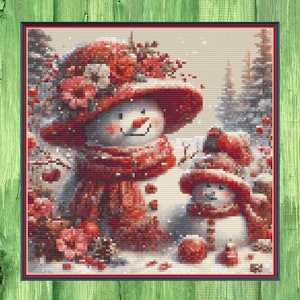 May include: Two snowmen standing in a snowy winter scene. The larger snowman is wearing a red hat with a floral design and a red scarf. The smaller snowman is wearing a red hat and scarf. Both snowmen have black eyes and a carrot nose.