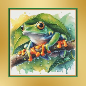 Könnte beinhalten: Ein grüner und orangefarbener Frosch mit großen, ausdrucksstarken Augen sitzt auf einem Ast mit grünen Blättern. Der Frosch sitzt auf einem Ast mit Wassertropfen auf den Blättern.