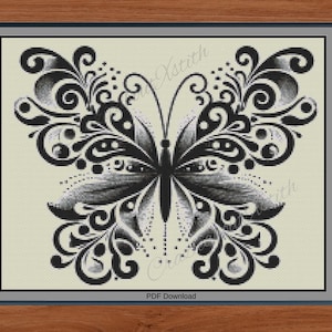 May include: Black and white butterfly design cross-stitch pattern. The butterfly features intricate details with swirling patterns and dotted accents. The design is set against a light beige background, framed in a gray border, and labeled "PDF Download".