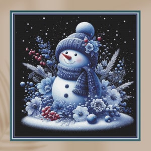 May include: A blue snowman with a blue knit hat and scarf surrounded by blue flowers and berries on a black background with white snowflakes.