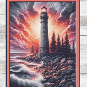 May include: A framed cross-stitch depicting a lighthouse at sunset. The lighthouse is grey with a lit lamp. The sky is filled with orange and purple clouds. Ocean waves crash against the rocky shore. The text "PDF Download" is at the bottom.