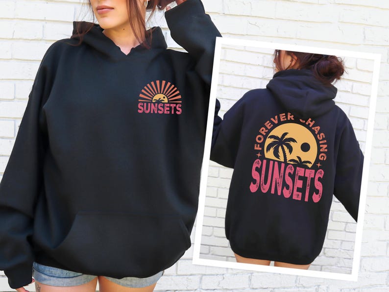 a woman wearing a black sweatshirt with sunsets on it