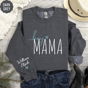 a gray sweatshirt with the word'love you mama'printed on it