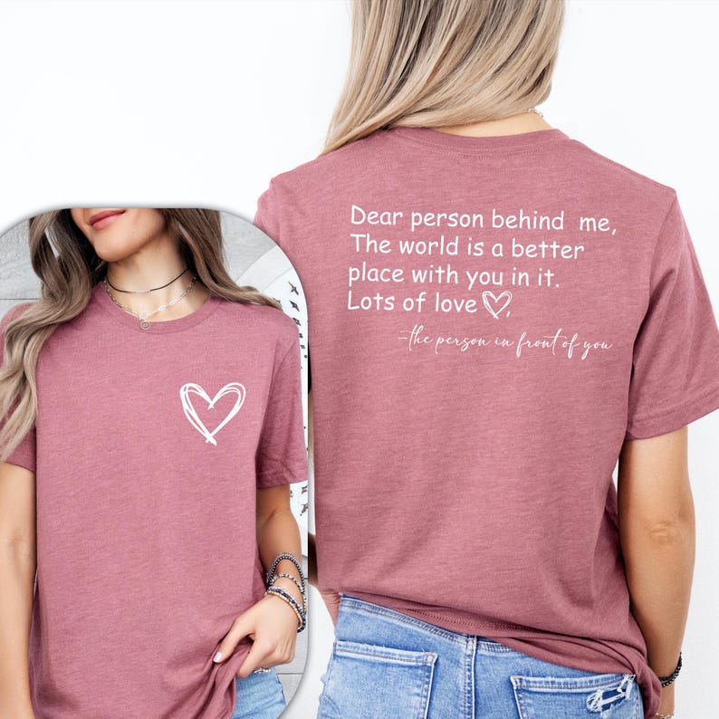 a woman wearing a t - shirt that says dear person behind me, the world