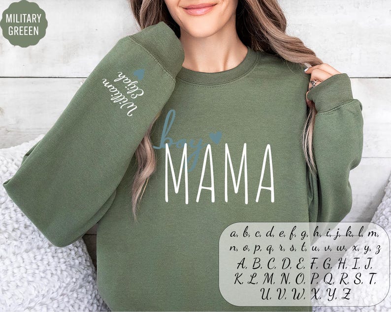 a woman wearing a sweatshirt with the word mama on it