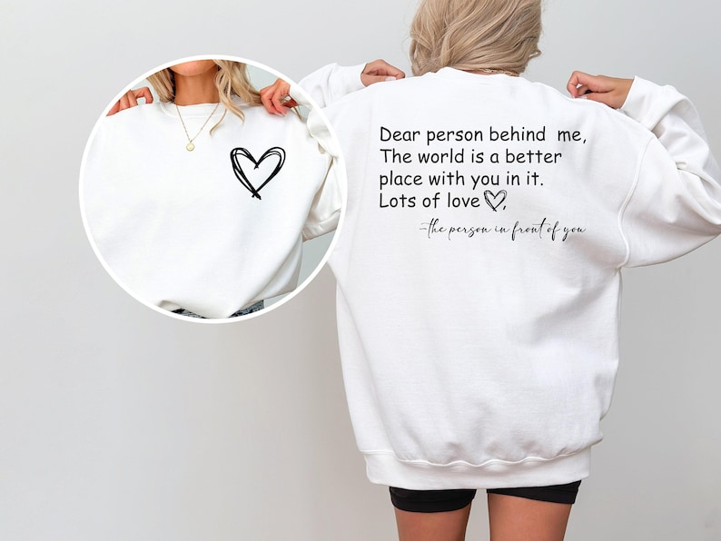 a woman wearing a sweatshirt with a quote on it