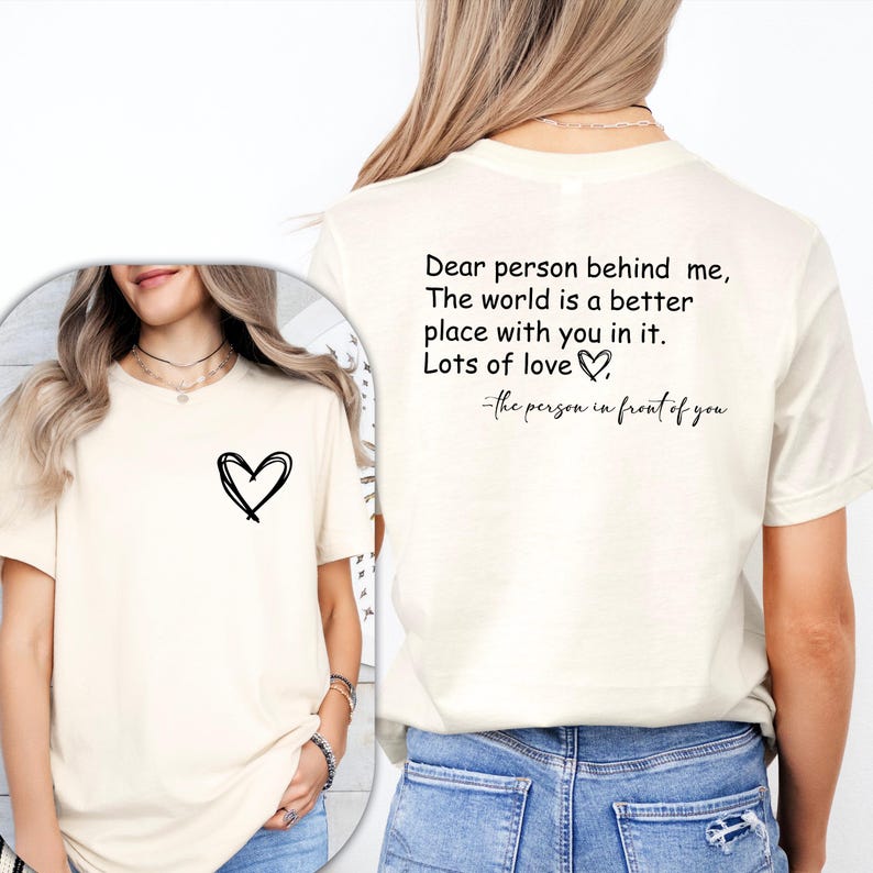 a woman wearing a t - shirt with a heart on it