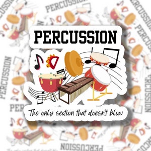 May include: A sticker with a cartoon illustration of various percussion instruments, including a drum set, xylophone, timpani, and cymbals. The sticker has the text "PERCUSSION" in bold black letters at the top and "The only section that doesn't blow" in black letters at the bottom.