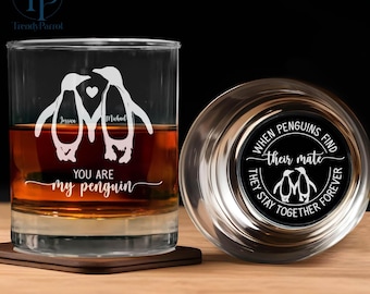May include: Two clear glass tumblers with a penguin couple design. The tumbler on the left has the text "Jessica" and "Michael" on the penguins. The tumbler on the right has the text "When penguins find their mate, they stay together forever".