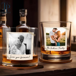 May include: Two whiskey glasses with personalized photos taped to the front. One glass has a black and white photo with the text "Love you forever!". The other glass has a family photo with the text "The Jacksons Family."