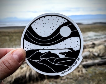 May include: A black and white sticker with a stylized design of a wave, mountains, and a moon. The sticker is round and has the text "Northwest by Nature" printed on the bottom.