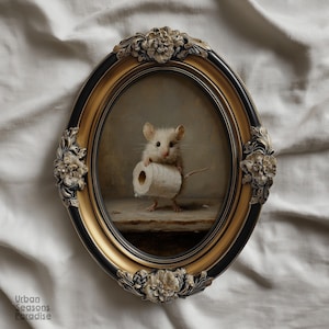 May include: An oval-shaped wall art piece featuring a painting of a small white mouse holding a roll of toilet paper. The artwork is encased in an ornate, decorative black and gold frame with floral relief details at the top, bottom, and sides.