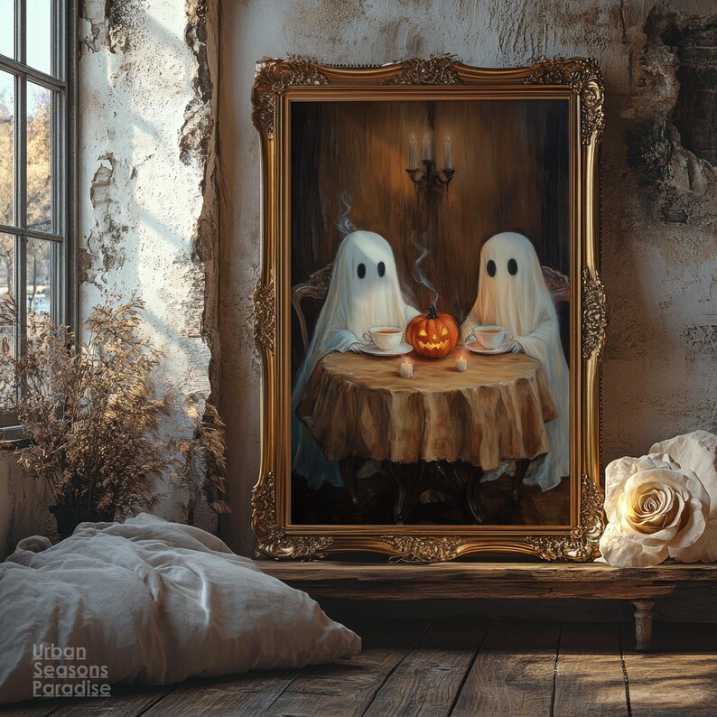 May include: A framed painting depicts two ghosts seated at a table with a carved pumpkin and teacups. The artwork is in a gold ornate frame, set against a rustic wall. The scene evokes a Halloween theme with a vintage aesthetic.