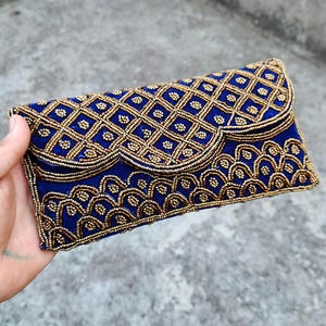 Blue velvet bridal clutch bag with braided shoulder strap