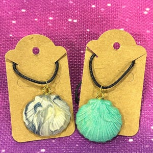 May include: A set of three ceramic vases in varying heights. The vases are white with a textured, ridged design. The tallest vase is approximately 10 inches tall, the medium vase is 8 inches, and the smallest is 6 inches.