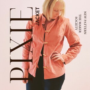 May include: A pink jacket with wooden toggle closures. The text "NEW PATTERN THE MAKER SOCIETY" is visible on the right side of the image. The text "JACKET" is visible on the left side of the image. The text "PIXIE" is visible in the lower left corner of the image.