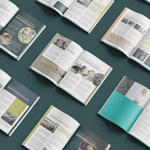 May include: Multiple open magazines are displayed on a dark teal surface. The magazines contain articles with images and text, covering topics such as productivity, development, and introduction. The pages have a clean, modern design with a mix of colours.