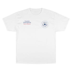 May include: White t-shirt featuring the text "CLOUD ENGINEER Rain Maker" in blue and red. A blue and white circular graphic is on the right side of the shirt. The shirt is made of a soft, comfortable material.