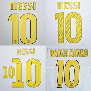 Könnte beinhalten: Vier gelbe und schwarze Fußballtrikotnummern, jede mit dem Namen "MESSI" oder "RONALDINHO" über der Nummer "10".