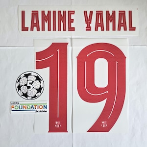 May include: Red and white football shirt number 19 with the name "Lamine Yamal" above the number. The shirt also features a UEFA Foundation for Children logo.