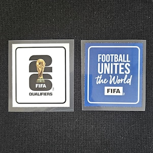 May include: Two square stickers. One features the FIFA trophy, the text "FIFA QUALIFIERS", and the FIFA logo. The other sticker has the text "FOOTBALL UNITES the World" and the FIFA logo, set against a blue background.