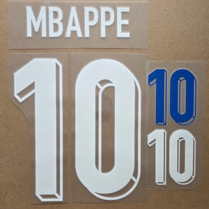 May include: A set of heat transfer decals featuring the name MBAPPE in white capital letters, a large white number 10 with a 3D effect, and smaller versions of the number 10 in both blue and white, all on a clear adhesive backing sheet.