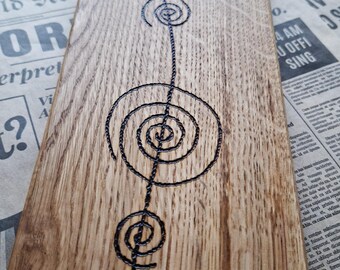 Oak serving board Spiral with a burnt pattern