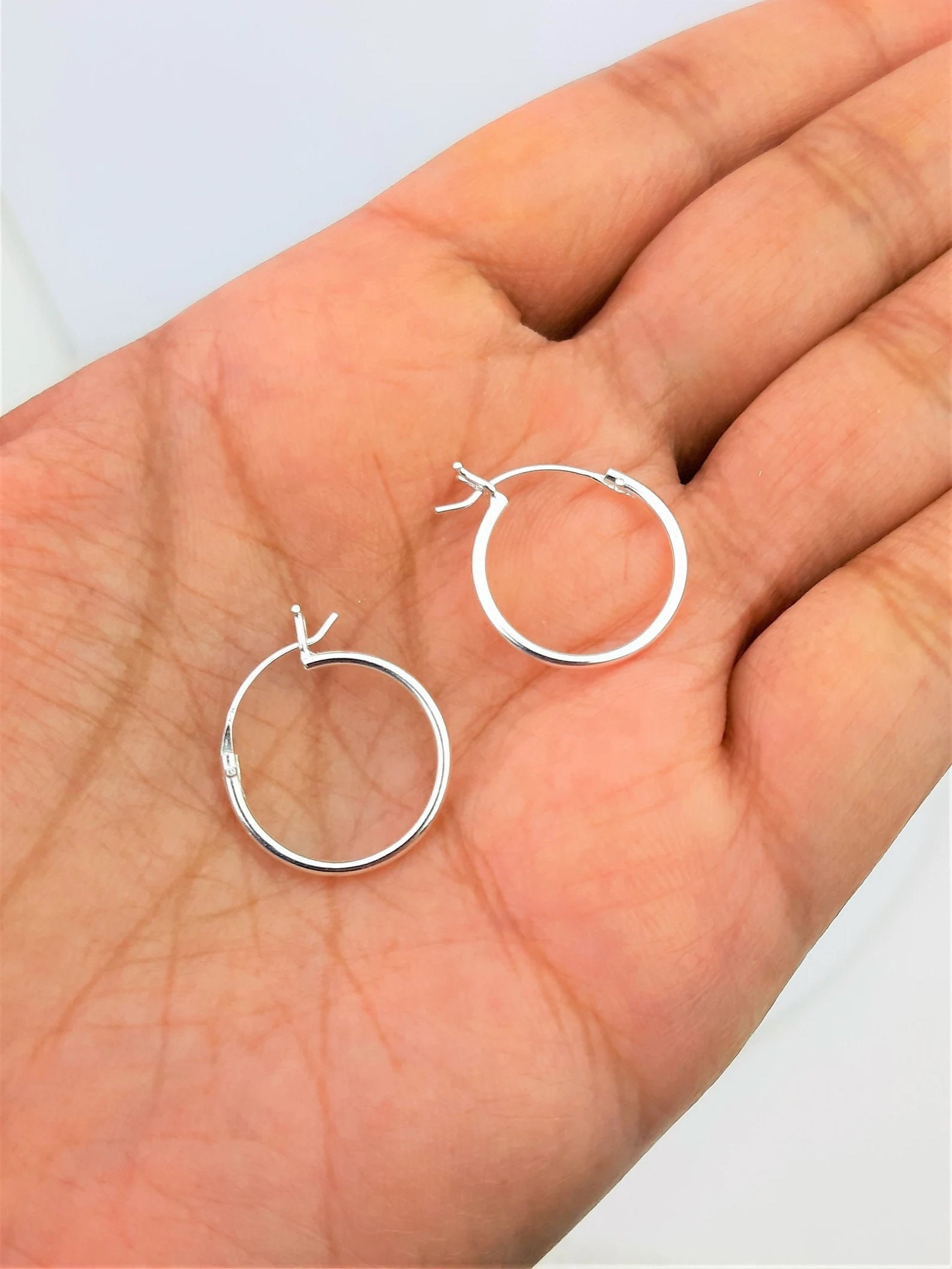Locking hoop earrings sale