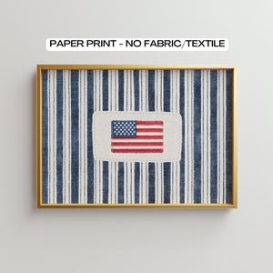 May include: A rectangular paper print in a gold frame featuring a blue and white vertical striped pattern. Centered on the stripes is a rectangular off-white patch displaying a small American flag. The text PAPER PRINT - NO FABRIC/TEXTILE is visible.