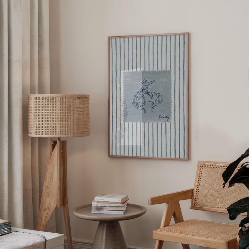 Add a bold statement to your space with this vintage striped rodeo print. Featuring retro blue and white stripes with a rustic western vibe, this cowboy poster is perfect for adding western bedroom wall art flair. The charming retro horse print blends seamlessly into rustic mid century modern home decor styles and makes a cute accent for dorm decor. Ideal for rodeo lovers, cowboy fans, and anyone who loves unique vintage western style.