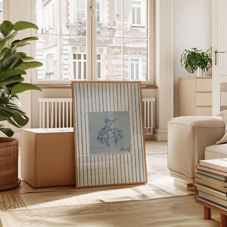 Add a bold statement to your space with this vintage striped rodeo print. Featuring retro blue and white stripes with a rustic western vibe, this cowboy poster is perfect for adding western bedroom wall art flair. The charming retro horse print blends seamlessly into rustic mid century modern home decor styles and makes a cute accent for dorm decor. Ideal for rodeo lovers, cowboy fans, and anyone who loves unique vintage western style.
