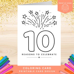 May include: A white coloring card with a black outline design. The card features a large number 10, fireworks, and the text "REASONS TO CELEBRATE." The bottom of the card reads "COLORING CARD PRINTABLE CARD DESIGN."
