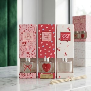 May include: A white ceramic mug with a black handle and the text "But first, coffee" in a handwritten style. The mug is on a white surface. The mug is 10 cm tall.